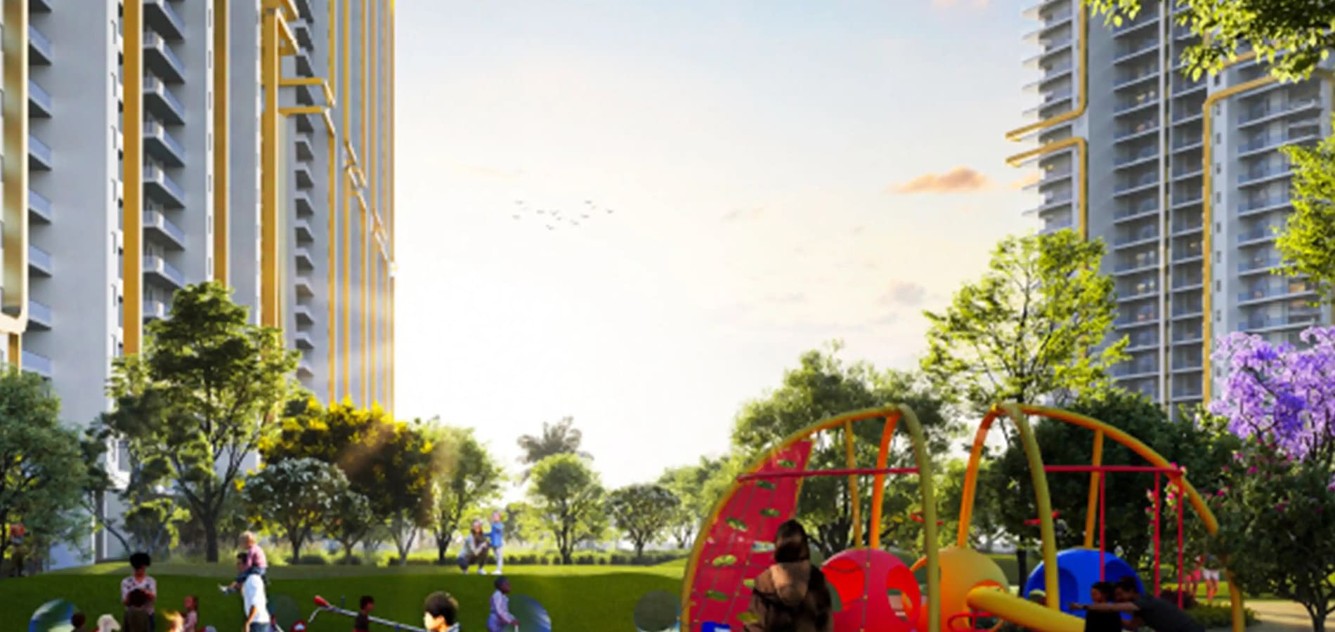 Vibrant children's playground area situated in a lush green lawn between high-rise luxury apartment towers