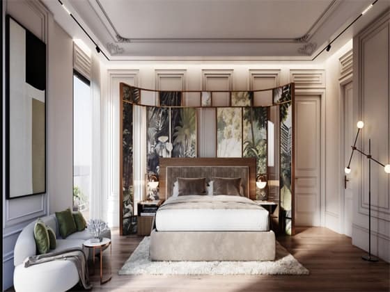 Elegant modern bedroom featuring a plush white bed, decorative wall panels with tropical nature patterns, and a sleek chaise lounge sofa