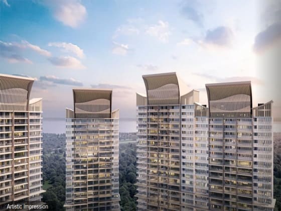 Close-up architectural view of the distinctive curved crown roofs on luxury residential towers against a sunset sky
